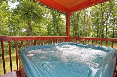 Photo 1354_3329.jpg - Sparkling clean hot tub on covered deck.
