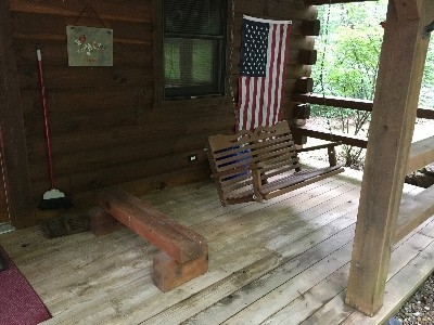 Photo 1426_5201.jpg - Relax on the front porch swing and take in the serenity of the quiet and scenic surroundings.