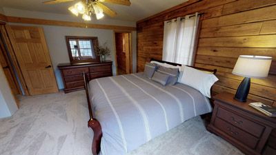 Master Suite - Large master bedroom with a king bed that is connected to  a bathroom.