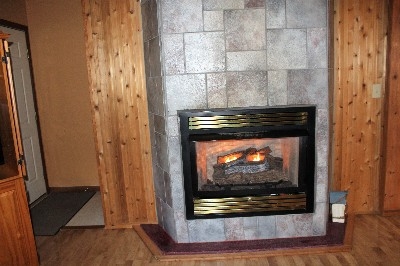 Photo 306_4313.jpg - This fireplace is so cozy and warm.  It is perfect for snowy cold days.