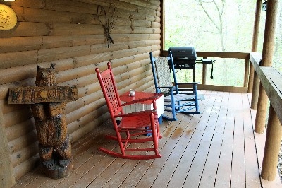 Photo 306_4480.jpg - One of the porches at the Great Frontier. Gas grill and rockers are all for you.
