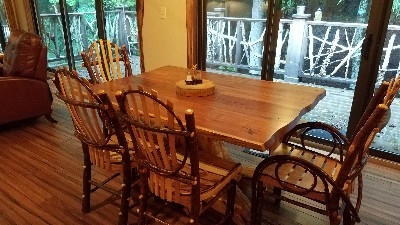 Photo 619_5289.jpg - Custom built furniture highlights the eating area.