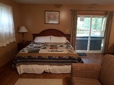 Photo 621_4150.jpg - The open floor plan offers both a king size bed and a sofa bed for you to relax and enjoy the peace and quiet of a good nights rest.  