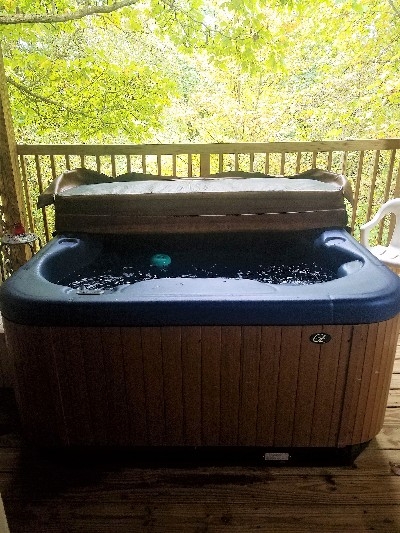 Photo 621_4154.jpg - Come and relax in your very own hot tub while soaking in the surrounding beauty. 